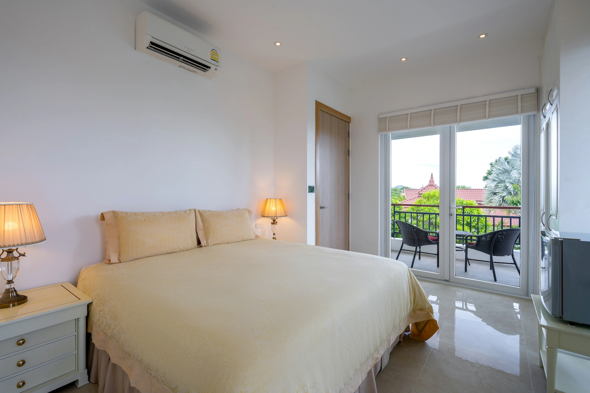 Double bedroom opening onto a covered private balcony